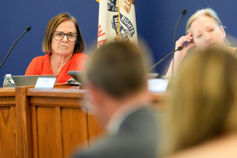 Board Vice President Molly Abraham, left, listens during an Iowa City Community School District board meeting Sept. 9, 2025 in Iowa City, Iowa.