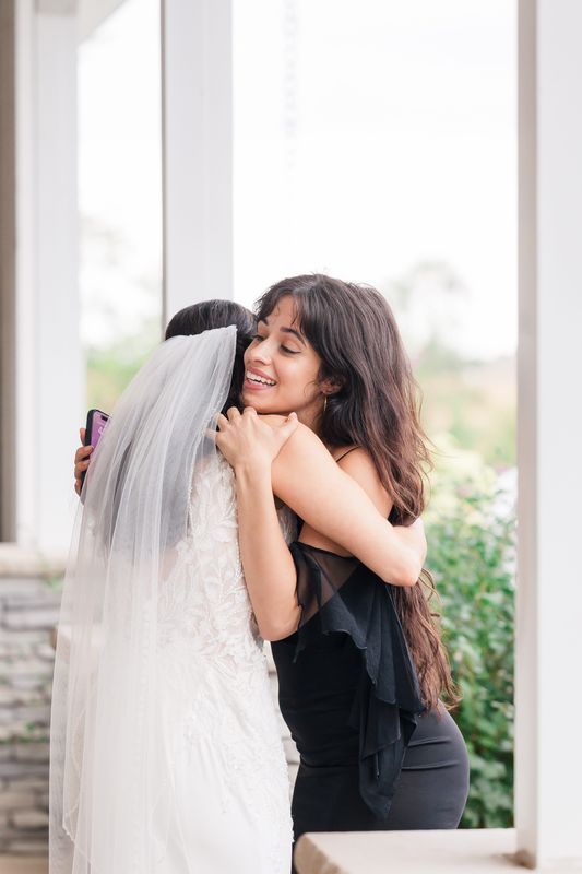 Singer Camila Cabello hugs Kelli Elsen after singing for Elsen's father-daughter dance in Iowa City, Iowa on Sept. 20, 2025.