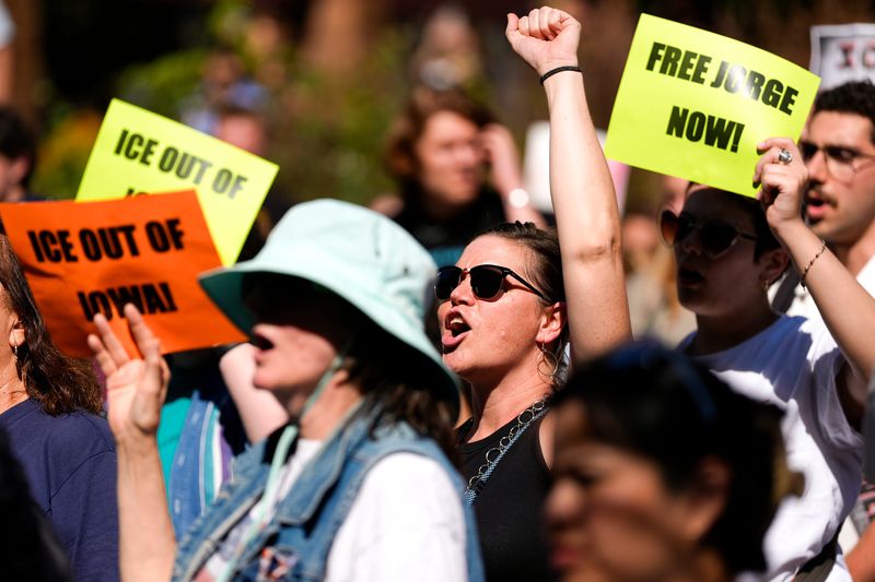 Community members rally to decry the arrest of Jorge Elieser González Ochoa on Sept. 26, 2025 on the pedestrian mall in downtown Iowa City, Iowa.