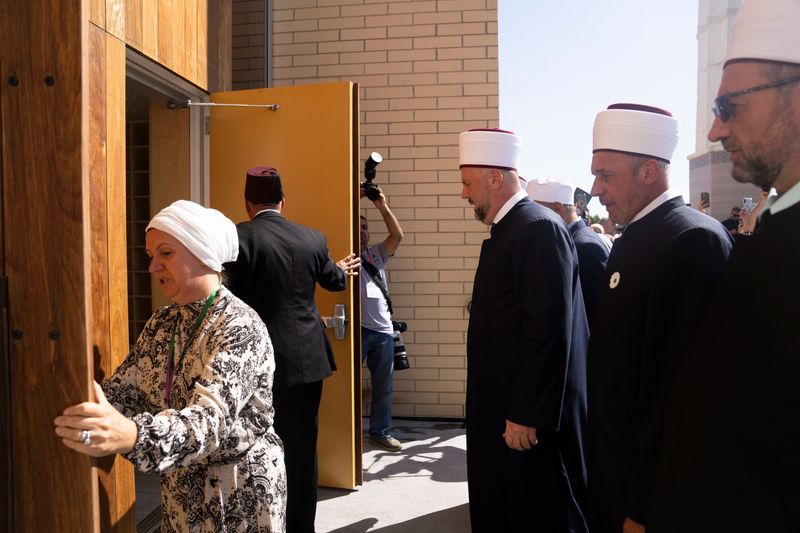 Mosque officials open the front doors during a grand opening ceremony for Es-Selam Mosque on Saturday, Sept. 27, 2025, in Granger.