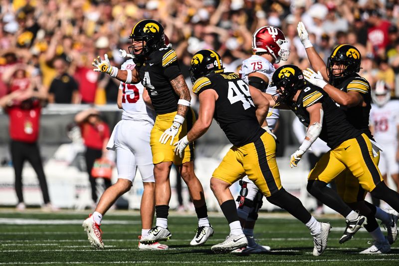 Iowa defensive back Koen Entringer and defensive lineman Ethan Hurkett and teammates react after a fourth down stop against the Indiana Hoosiers on Saturday, Sept. 27, 2025 at Kinnick Stadium in Iowa City, Iowa.
