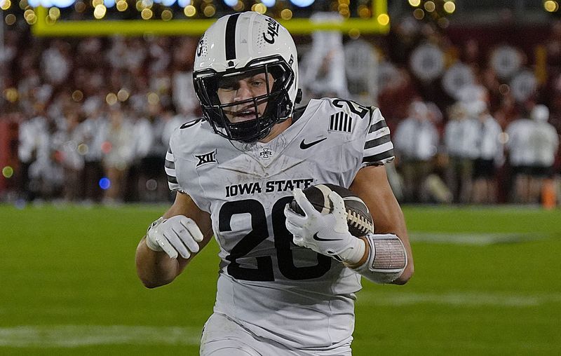 Iowa State Cyclones' running back Carson Hansen (26) runs with the ball for a first down during the fourth quarter in the Big-12 conference showdown on Sept. 27, 2025, at Jack Trice Stadium in Ames, Iowa.