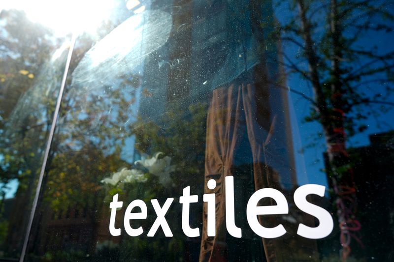 A sign for Textiles clothing store is pictured Sept. 29, 2025 in downtown Iowa City, Iowa.