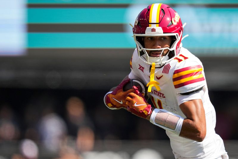 Oct 4, 2025; Cincinnati, Ohio, USA; Iowa State Cyclones wide receiver Dominic Overby (11) makes a catch against the Cincinnati Bearcats in the first half at Nippert Stadium. Mandatory Credit: Aaron Doster-Imagn Images