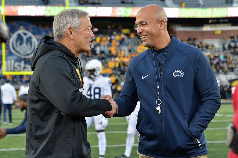 Oct 12, 2019; Iowa City, IA, USA; Penn State Nittany Lions head coach James Franklin (left) and Iowa Hawkeyes head coach Kirk Ferentz (right) shake hands before the game at Kinnick Stadium. Mandatory Credit: Jeffrey Becker-USA TODAY Sports