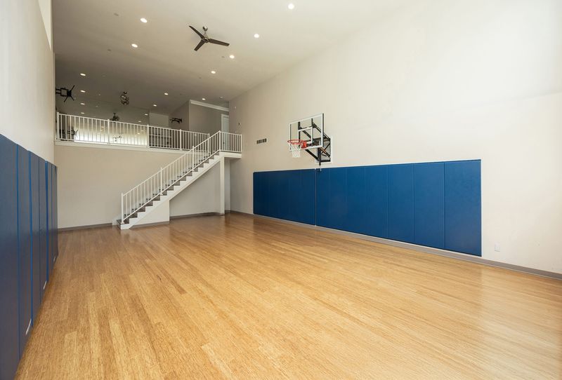 Basketball court inside home for sale at 4701 150th St, Urbandale.