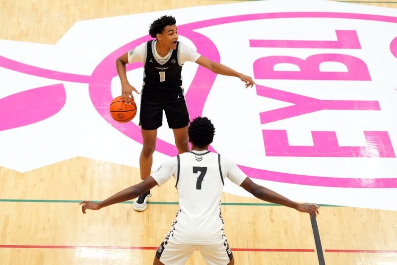 July 19, 2025; North Augusta, South Carolina, USA; Brad Beal Elite Quentin Coleman (1) gestures to a teammate as Team Durant Evans Barning Jr. (7) defends during the Brad Beal Elite and Team Durant game at the Nike EYBL Peach Jam at Riverview Park Activity Center. Brad Beal Elite won 91-59. Mandatory Credit: Katie Goodale - Augusta Chronicle/USA TODAY NETWORK