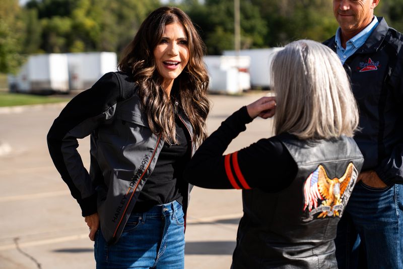 Secretary of Homeland Security Kristi Noem walks with Sen. Joni Ernst during Iowa’s Roast and Ride on Oct. 11, 2025, in Des Moines.