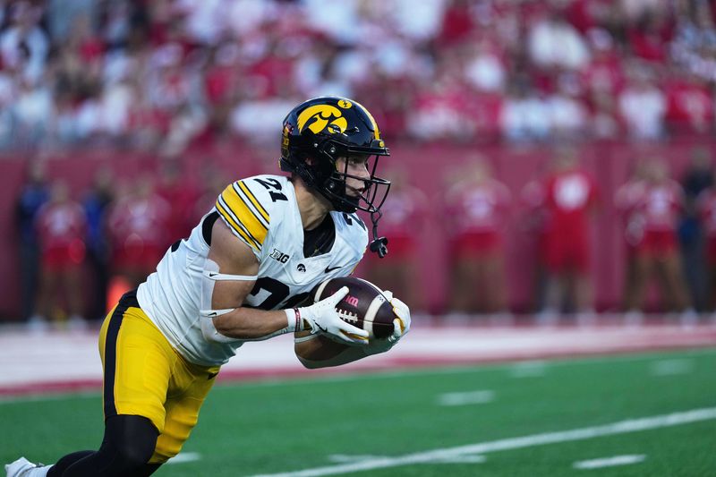 Oct 11, 2025; Madison, Wisconsin, USA; Iowa Hawkeyes wide receiver Kaden Wetjen (21) takes the opening kickoff during the first half against the Wisconsin Badgers at Camp Randall Stadium. Mandatory Credit: Ross Harried-Imagn Images