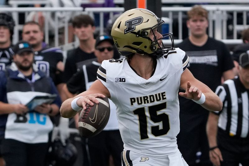 Oct 18, 2025; Evanston, Illinois, USA; Purdue Boilermakers quarterback Ryan Browne (15) passes the ball against the Northwestern Wildcats during the first half at Northwestern Medicine Field at Martin Stadium. Mandatory Credit: David Banks-Imagn Images