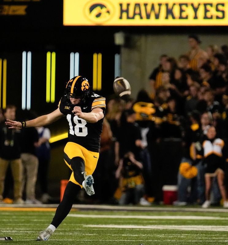 Iowa Hawkeyes kicker Drew Stevens (18) kicks to Penn State during a college football game Oct. 18, 2025 at Kinnick Stadium in Iowa City, Iowa.