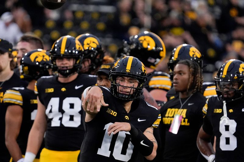 Iowa Hawkeyes quarterback Jeremy Hecklinski (10) throws a pass during warmups before a college football game against the Penn State Nittany Lions Oct. 18, 2025 at Kinnick Stadium in Iowa City, Iowa.