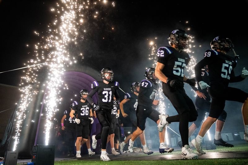 Waukee football takes the field for a game against Waterloo West on Oct. 24, 2025, at Waukee Stadium.
