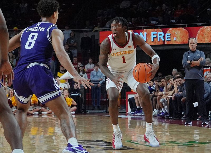 Iowa State Cyclones guard Jamarion Batemon (1) looks for drive around Northwestern Wildcats forward Tre Singleton during the second half of an exhibition match at Hilton Coliseum on Oct. 26, 2025, in Ames, Iowa.