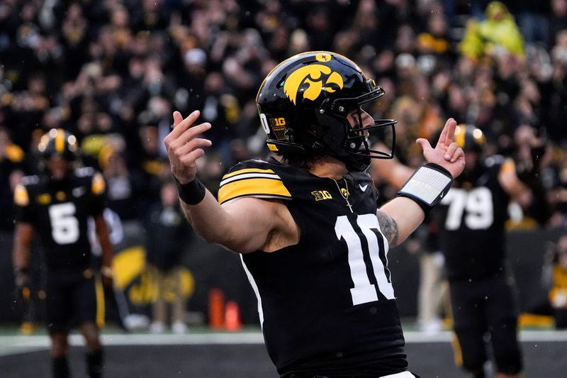 Iowa Hawkeyes quarterback Jeremy Hecklinski (10) celebrates after scoring a touchdown against the Minnesota Golden Gophers Oct. 25, 2025 at Kinnick Stadium in Iowa City, Iowa.
