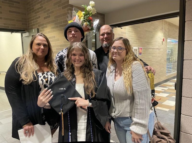 Ruth Robison, left, and her husband Tony, rear, far right, gather May 26, 2022, for the high school graduation of daughter Chayse, center. Sister Jasmyne Robison is at right and brother Hudson Robison is at rear center. Ruth and Tony Robison were both shot, Ruth Robison fatally, in November 2024 by their daughter Jasmyne's ex while helping her move out of the home she'd shared with him.