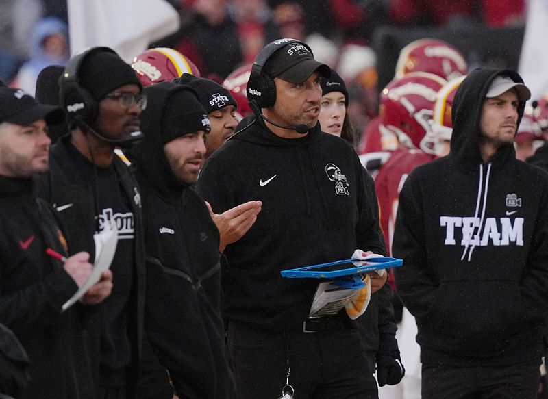 Iowa State Cyclones' football head coach Matt Campbell talks to coaching staffs at the sideline against Arizona State during the third quarter in the Big-12 showdown at jack Trice Stadium on Nov. 1, 2025, in Ames, Iowa.