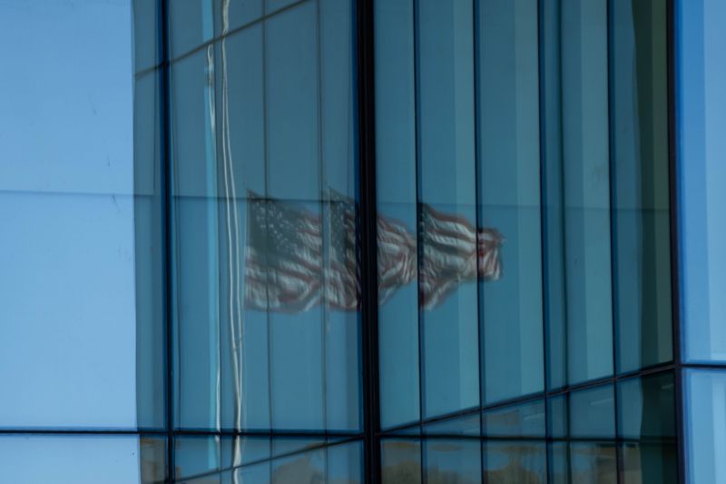 The American flag flies at half-staff at the U.S. Federal Courthouse in downtown Des Moines.