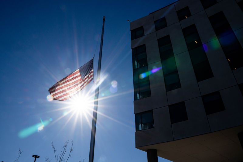 The American flag flies at half-staff at the U.S. Federal Courthouse in downtown Des Moines.