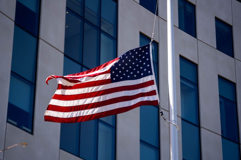 The American flag flies at half-staff at the U.S. Federal Courthouse in downtown Des Moines.