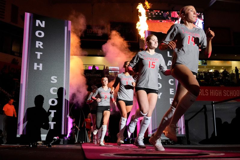 The North Scott Lady Lancers take the court Nov. 6, 2025 during a Class 4A Iowa high school state volleyball championship against Sioux Center in Coralville, Iowa.