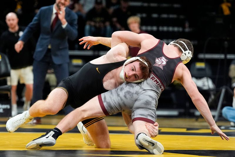 Iowa’s Michael Caliendo wrestles Bellarmine’s Noah Hall in a 165-pound match Nov. 6, 2025 at Carver-Hawkeye Arena in Iowa City, Iowa.
