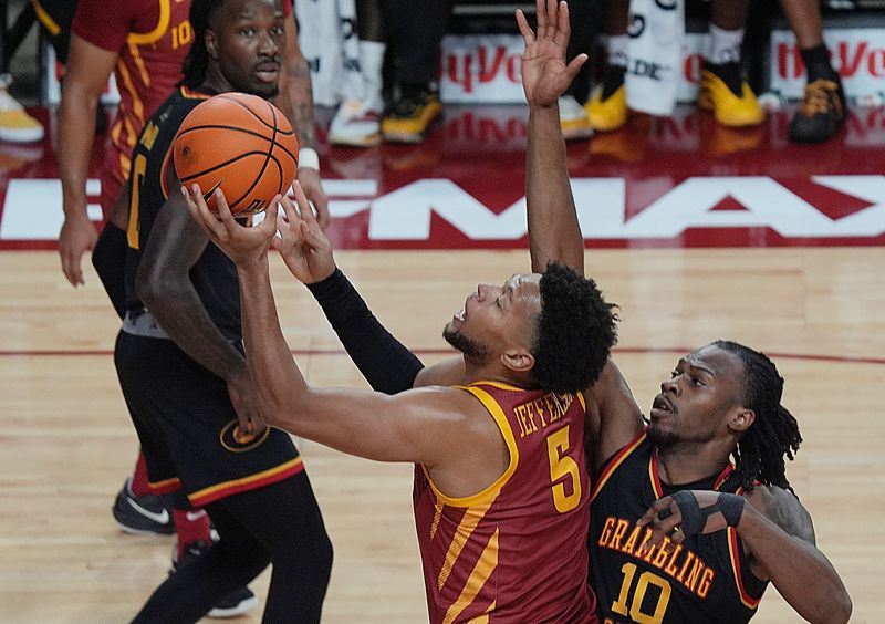 Iowa State Cyclones forward Joshua Jefferson (5) goes for a layup as Grambling State Tiger forward Richard Amaefule (10) defends during the first half on Nov. 6, 2025, at Hilton Coliseum in Ames, Iowa.