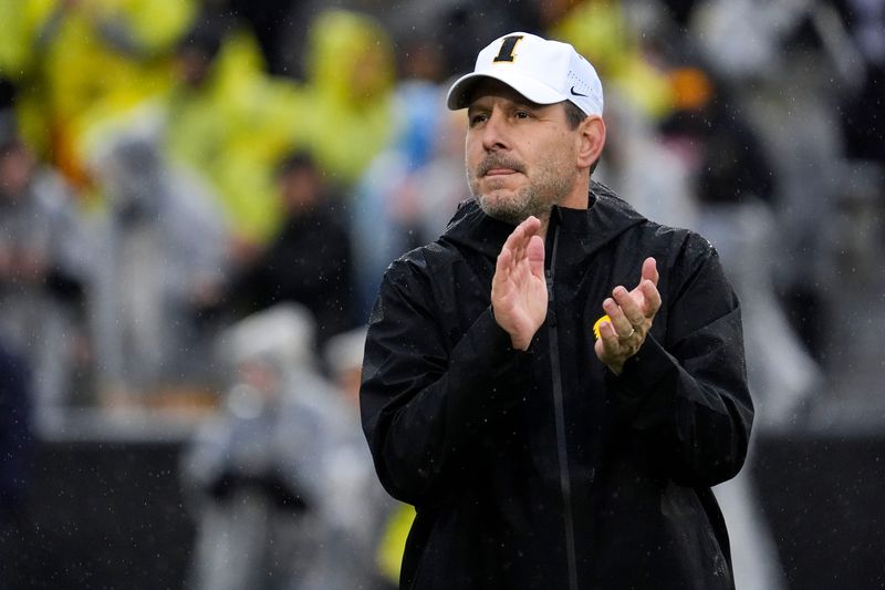 Iowa offensive coordinator Tim Lester watches warm ups Nov. 8, 2025 before a Big Ten Football game against the Oregon Ducks at Kinnick Stadium in Iowa City, Iowa.