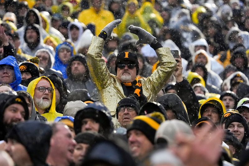 An Iowa fan cheers Nov. 8, 2025 during a Big Ten Football game against the Oregon Ducks at Kinnick Stadium in Iowa City, Iowa.