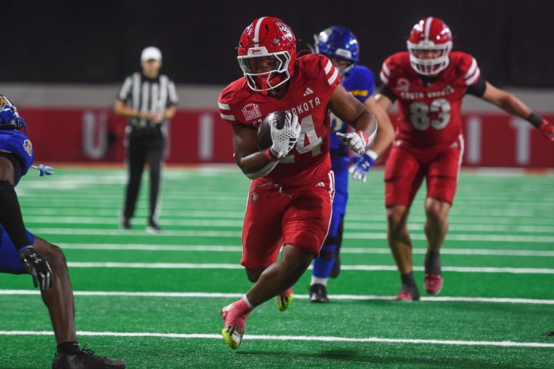 South Dakota Coyotes running back L.J. Phillips Jr. (24) runs the ball into the end zone for the touchdown during the Interstate Series on Saturday, Nov. 8, 2025, at Dakota Dome in Vermillion, South Dakota.