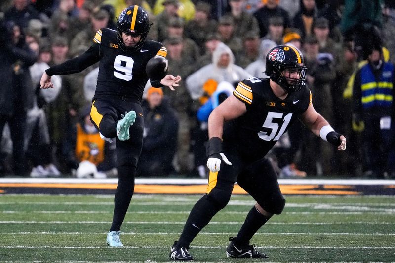 Iowa Hawkeyes punter Rhys Dakin (9) punts the ball Nov. 8, 2025 during a Big Ten Football game against the Oregon Ducks at Kinnick Stadium in Iowa City, Iowa.