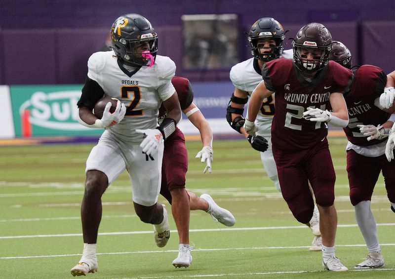 Regina's running back Savion Miller (2) runs with the ball for a first down against Grundy Center during the first quarter in the 1A High School state semi-final on Nov. 14, 2025, at UNI-Dome in Cedar Falls, Iowa.