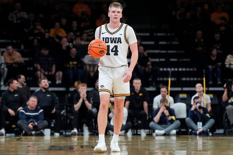 Iowa guard Bennett Stirtz (14) brings the ball up court against the Xavier Musketeers Nov. 14, 2025 at Carver-Hawkeye Arena in Iowa City, Iowa.