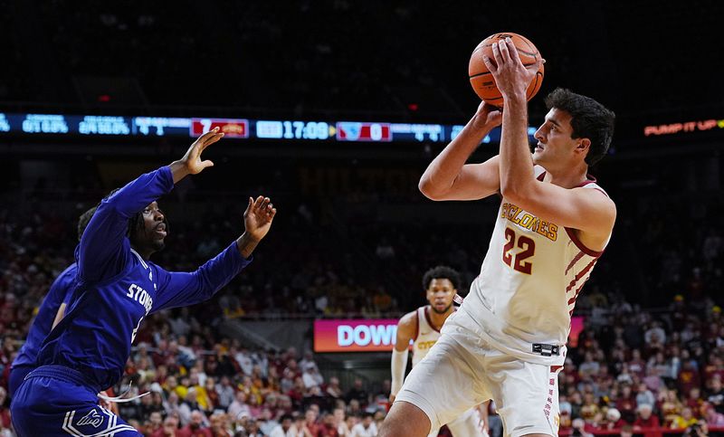 Iowa State Cyclones forward Milan Momcilovic (22) shoots the ball over the ball over Stonehill Skyhawks guard Trenton Ruth (2) during the first half in the NCAA basketball on Nov. 17, 2025, at Hilton Coliseum in Ames, Iowa.Iowa.