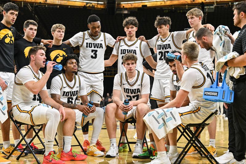 Nov 20, 2025; Iowa City, Iowa, USA; The Iowa Hawkeyes take a time-out during the first half against the Chicago State Cougars at Carver-Hawkeye Arena. Mandatory Credit: Jeffrey Becker-Imagn Images