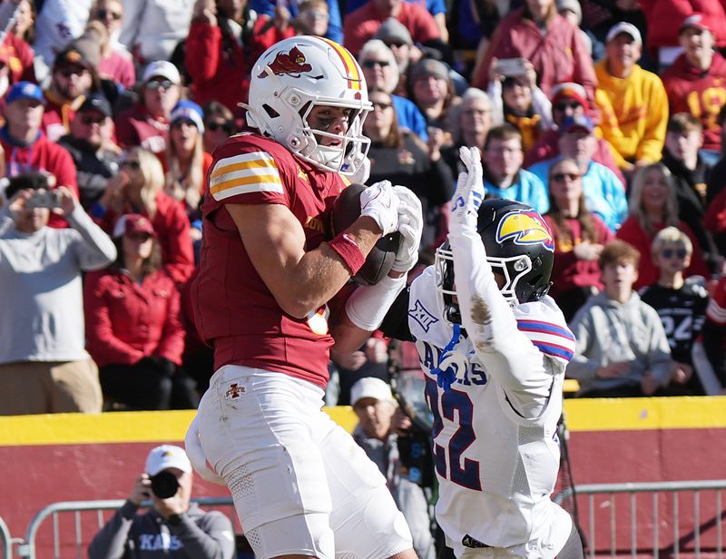 Iowa State Cyclones' wide receiver Brett Eskildsen (9) catches the ball for a touchdown around Kansas Jayhawks cornerback Syeed Gibbs (22) during the third quarter in the senior day on Nov. 22, 2025, at Jack Trice Stadium in Ames, Iowa