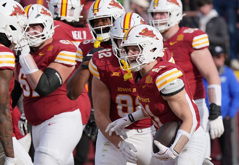 Iowa State Cyclones' running back Aiden Flora (21) celebrates with team mates after score a touchdown against Kansas during the fourth quarter in the senior day on Nov. 22, 2025, at Jack Trice Stadium in Ames, Iowa