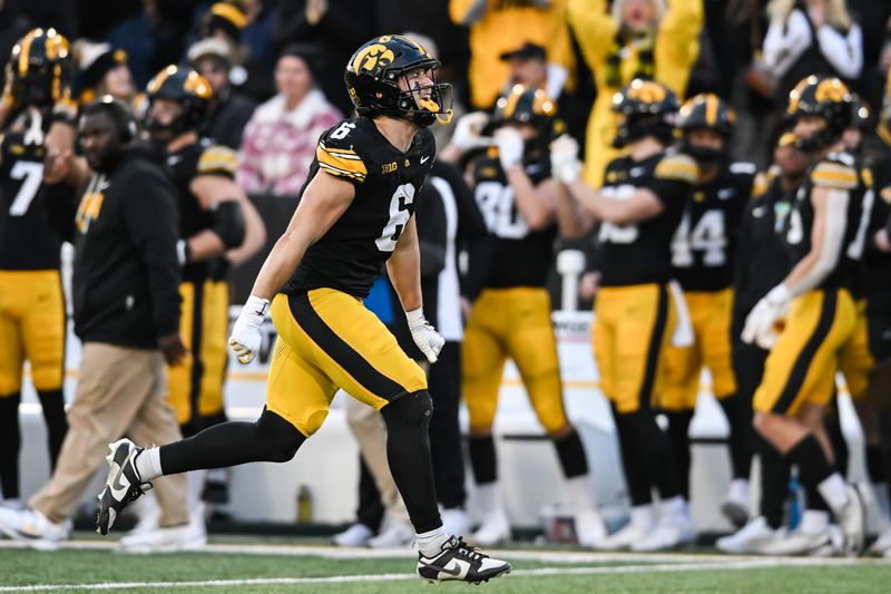 Nov 22, 2025; Iowa City, Iowa, USA; Iowa Hawkeyes defensive back Zach Lutmer (6) reacts after making an interception against the Michigan State Spartans during the second quarter at Kinnick Stadium. Mandatory Credit: Jeffrey Becker-Imagn Images