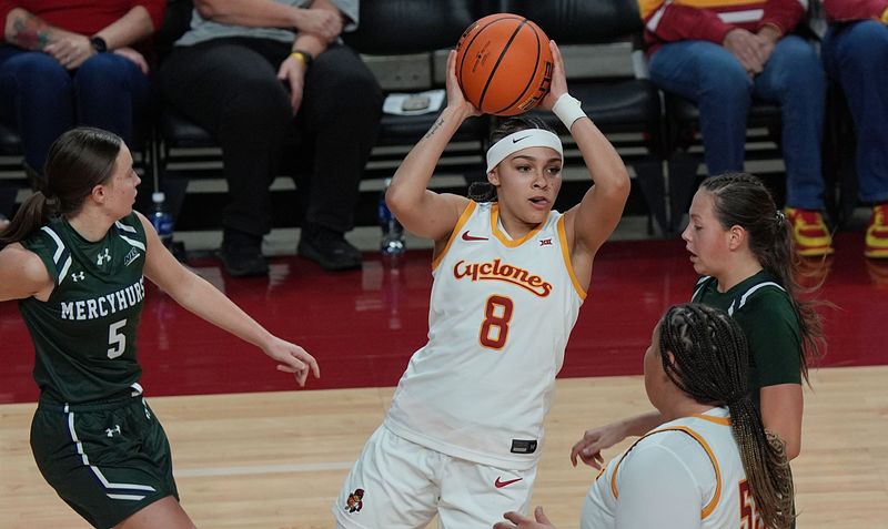 Iowa State Cyclones' guard Jada Williams (8) passes the ball between Mercyhurst Lakers guard Jenna Van Schaik (5) and guard Sofia Wilson (20) during the first quarter in the regular season NCAA women’s basketball on Nov. 23, 2025 in Ames, Iowa