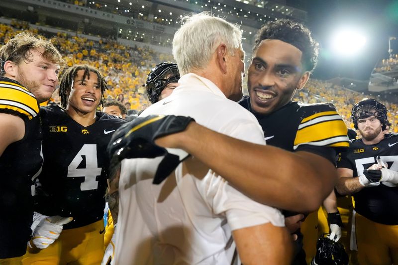Iowa Hawkeyes defensive back TJ Hall (2) hugs Iowa Hawkeyes head coach Kirk Ferentz after the Hawkeysâ€™ win against the Massachusetts Minutemen Sept. 13, 2025 at Kinnick Stadium in Iowa City, Iowa.