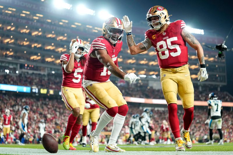 Nov 24, 2025; Santa Clara, California, USA; San Francisco 49ers wide receiver Jauan Jennings (15) and tight end George Kittle (85) react after scoring a touchdown against the Carolina Panthers during the first half at Levi's Stadium.