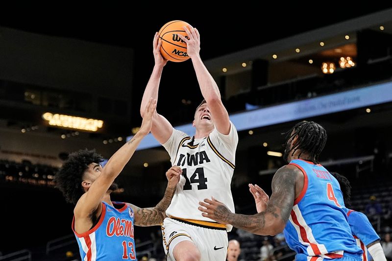 Iowa guard Bennett Stirtz (14) drives to the basket during the win against Ole Miss in the Acrisure Series at Acrisure Arena in Palm Desert, Calif., on Nov. 25, 2025.