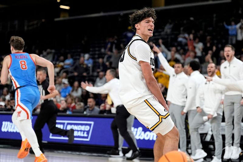 Iowa guard Isaia Howard (23) reacts after dunking against Ole Miss during the second half at Acrisure Arena in Palm Desert, Calif., on Nov. 25, 2025.