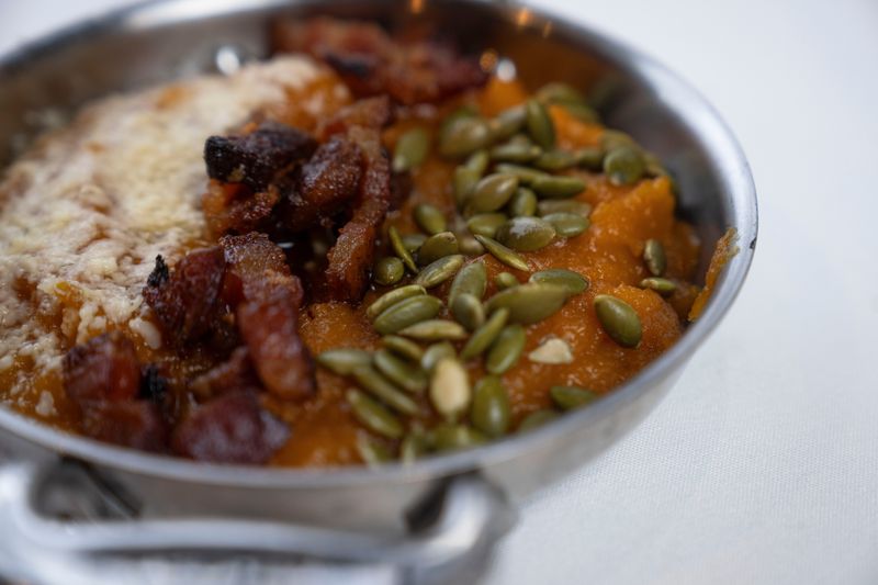A butternut squash dish with bacon and pepitas at Prime and Providence on Tuesday, Nov. 25, 2025, in West Des Moines.