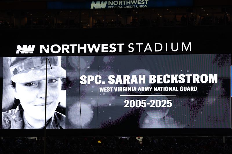 LANDOVER, MARYLAND - NOVEMBER 30: A dedication to Sarah Beckstrom is displayed on the scoreboard prior to the game between the Washington Commanders and the Denver Broncos at Northwest Stadium on November 30, 2025 in Landover, Maryland. (Photo by Scott Taetsch/Getty Images)