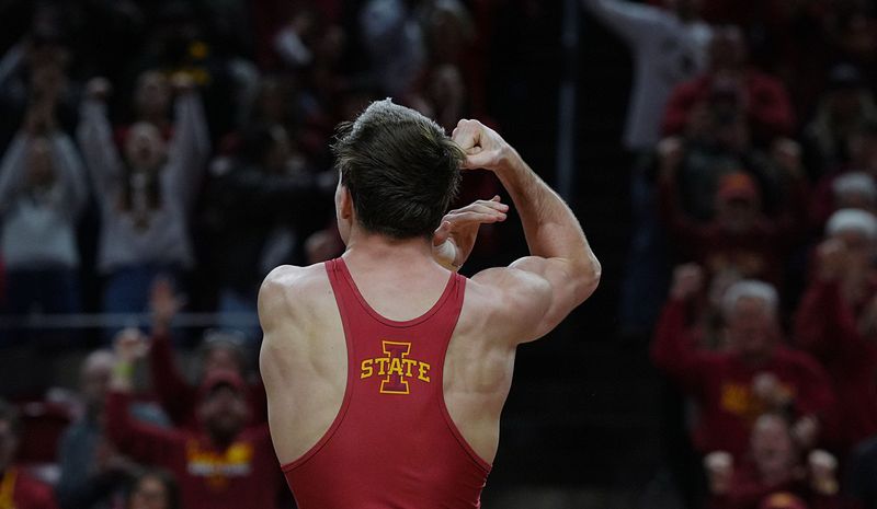 Iowa State Cyclones Evan Frost celebrates after winning over Iowa Hawkeyes Drake Ayala in their 133-pound wrestling in the Cy-Hawk Series on Nov. 30, 2025 at Hilton Coliseum in Ames, Iowa.