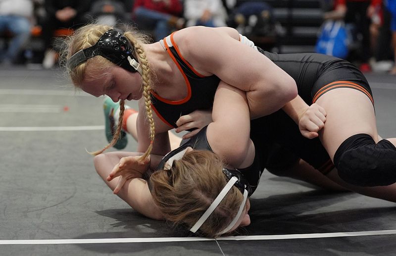 Lexa Rozevink, seen here competing in a triangular dual on Dec. 4 in Ames, is one of three girls wrestlers to qualify for state from Ames. Rozevink placed first at 135 pounds during the Class 2A Region 3 meet at Independence on Jan. 30.
