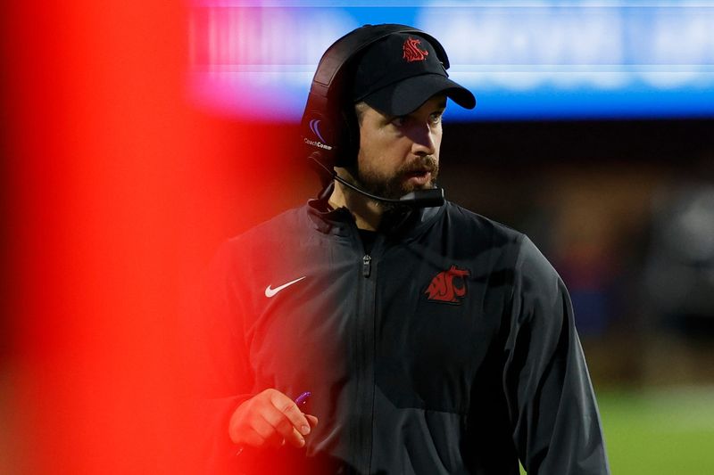 Oct 18, 2025; Charlottesville, Virginia, USA; Washington State Cougars head coach Jimmy Rogers looks on from the sidelines against the Virginia Cavaliers in the fourth quarter at Scott Stadium. Mandatory Credit: Geoff Burke-Imagn Images