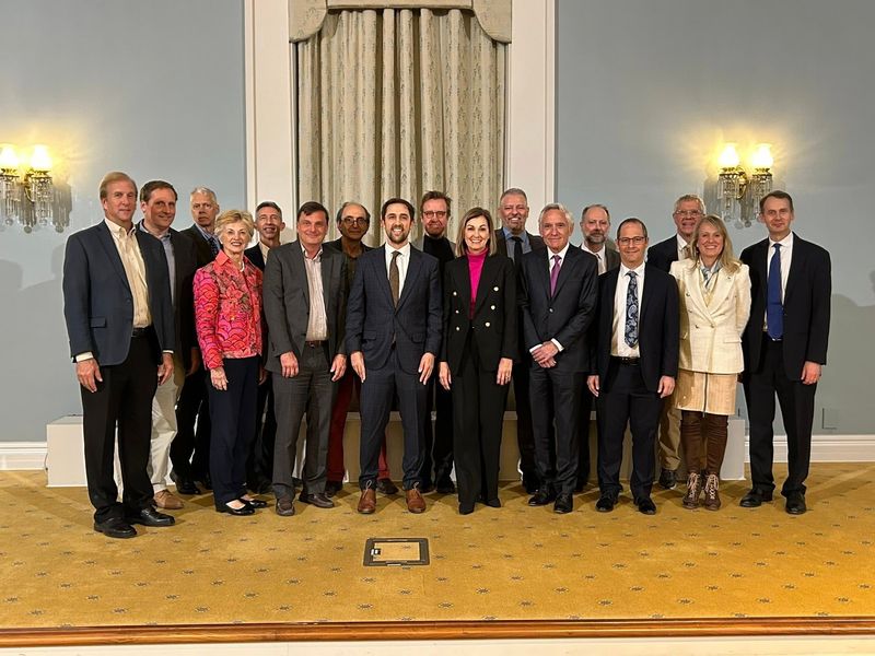 Gov. Kim Reynolds poses for a photo with the Iowa Board of Regents, U.S. Assistant Secretary for Postsecondary Education David Barker and activist Christopher Rufo at the Center for Intellectual Freedom's inaugural event at the University of Iowa.