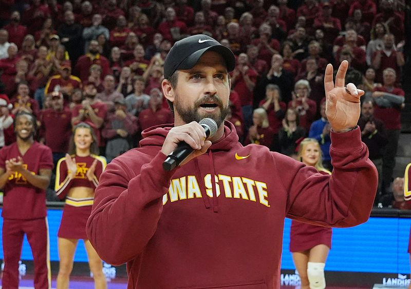 Iowa State football coach Jimmy Rogers speaks during a timeout in the Cy-Hawk men's basketball game on Dec. 11, 2025, at Hilton Coliseum in Ames.